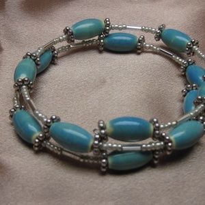 3/$20 Turquoise glass and silver wrap brac…